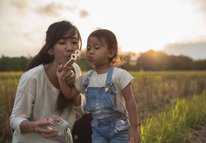 Mother and child spending time outdoors in natural sunlight to support healthy daily rhythms