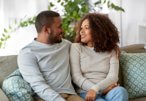 Young adult couple together at home representing fertility and preconception health