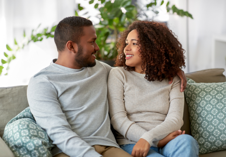 Young adult couple together at home representing fertility and preconception health