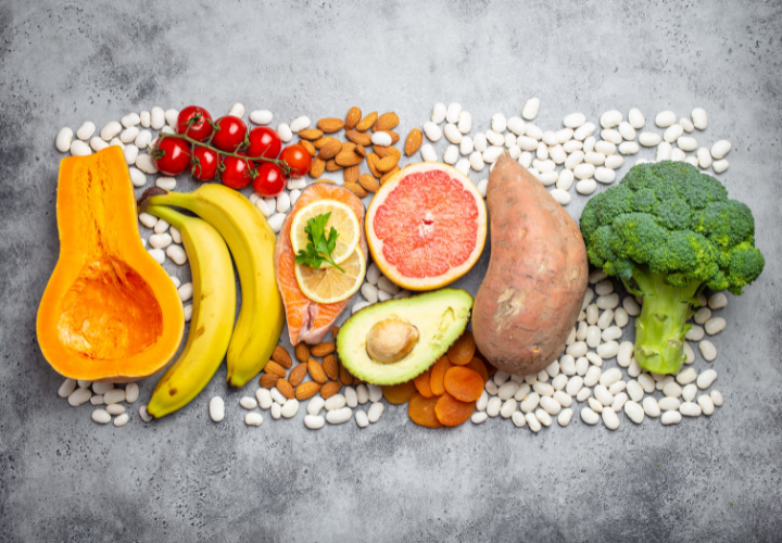 Fiber-rich whole foods including beans, whole grains, avocado, berries, vegetables, nuts, seeds, and fruit